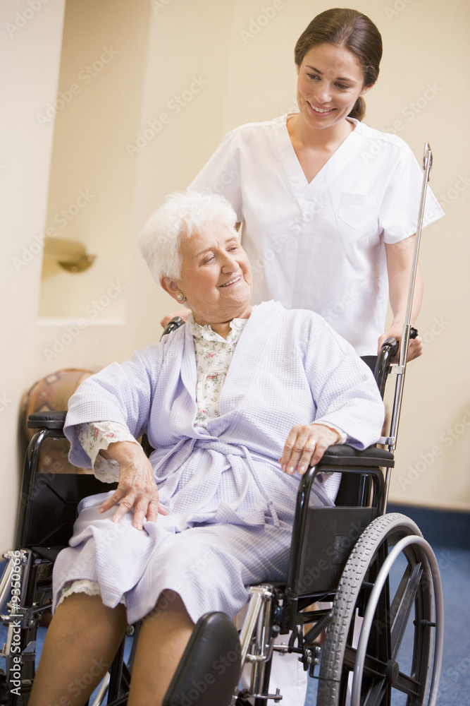 Nurse Pushing Woman In Wheelchair Nurse Pushing Woman In Wheelchair