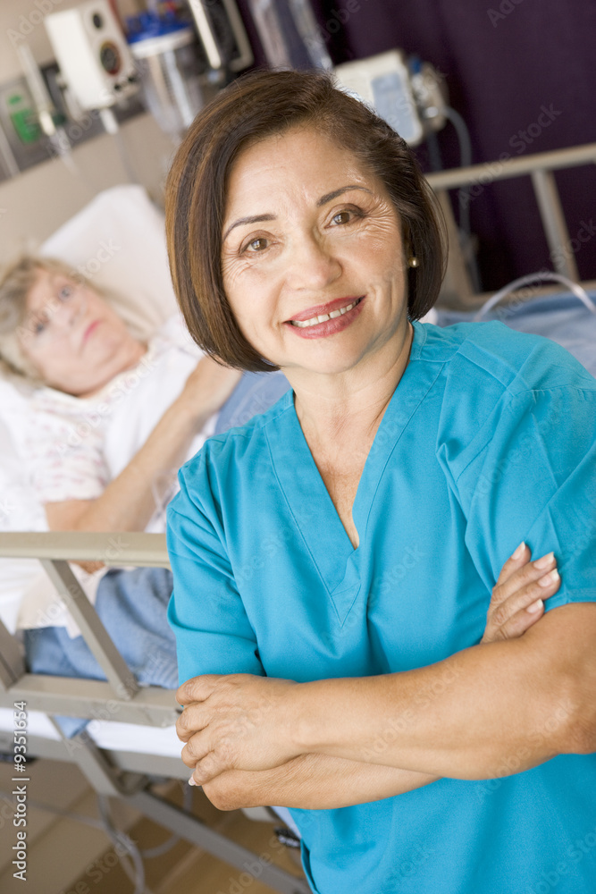 Doctor Standing With Arms Crossed In Her Patients Room