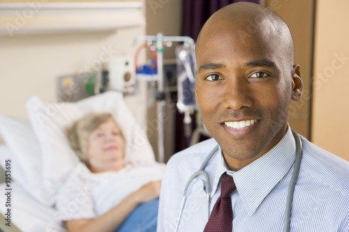 Doctor Smiling Standing In Hospital Room