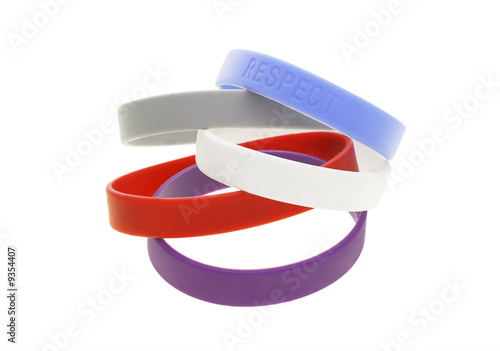 A stack of color wrist bands on white background photo