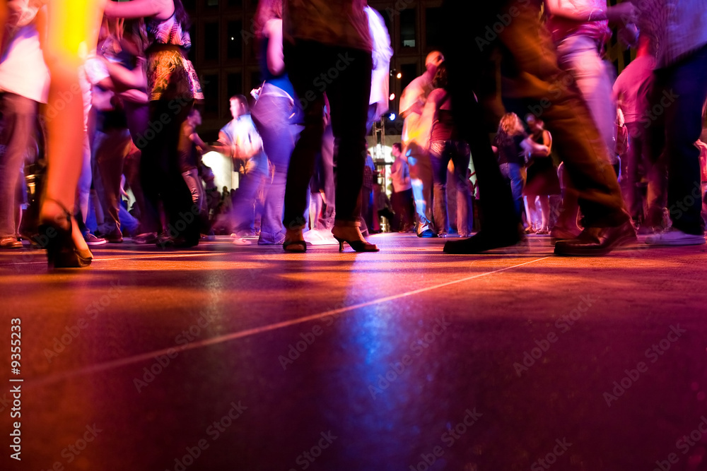 A low shot of the dance floor with people dancing - obrazy, fototapety, plakaty 