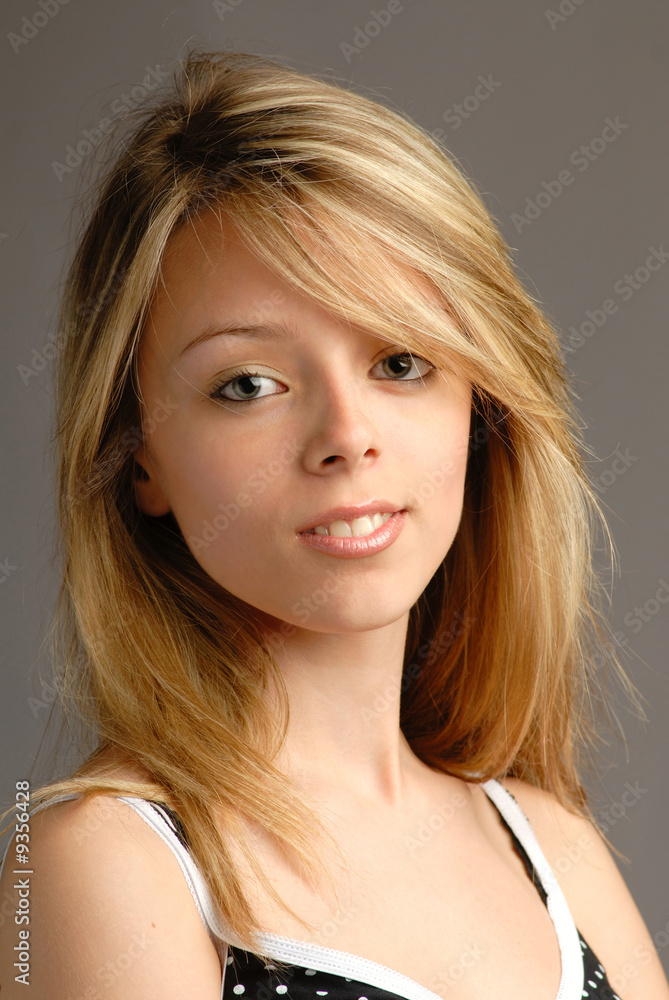 Portrait of girl in studio on grey background Portrait of girl in studio on grey background