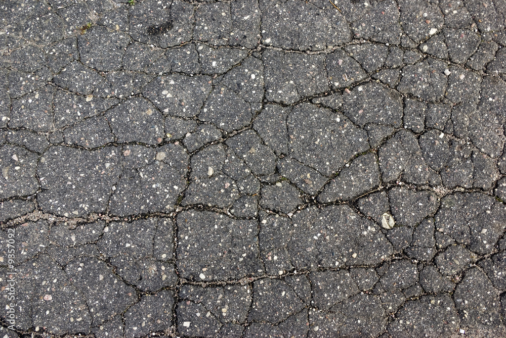 Obraz premium Very old asphalt - set of the cracks, damaged by weather.
