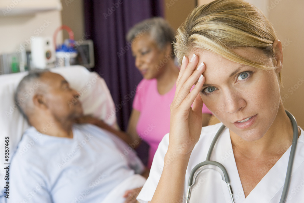 Doctor With Headache In Patients Room Doctor With Headache In Patients Room