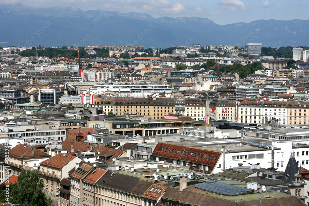 Cityscape of Geneva, Switzerland. Alps in background.