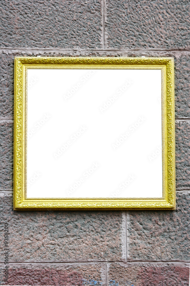 Fototapeta premium Blank antique frame over stone wall close-up