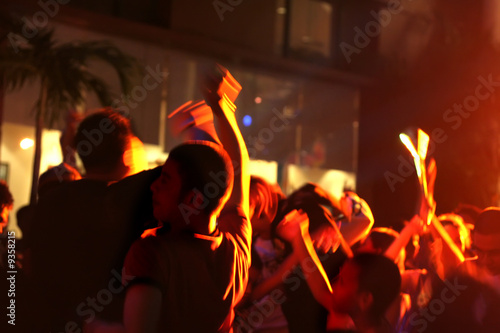 Photos people under party light