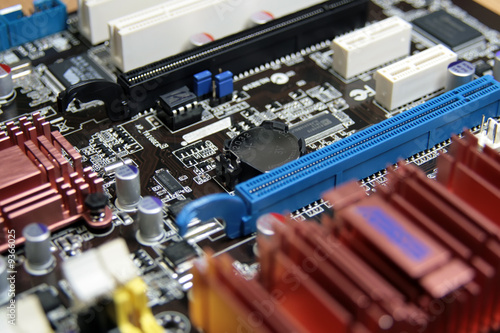 close-up photo of computer motherboard with lithium battary photo