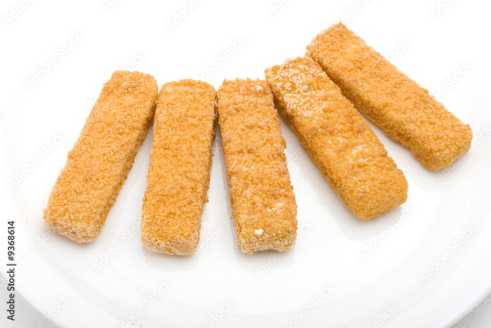frozen fish fingers on a white plate frozen fish fingers on a white plate