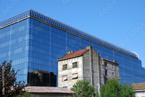 Wallpaper Mural modern new glass building by old brick house in Belgrade Torontodigital.ca