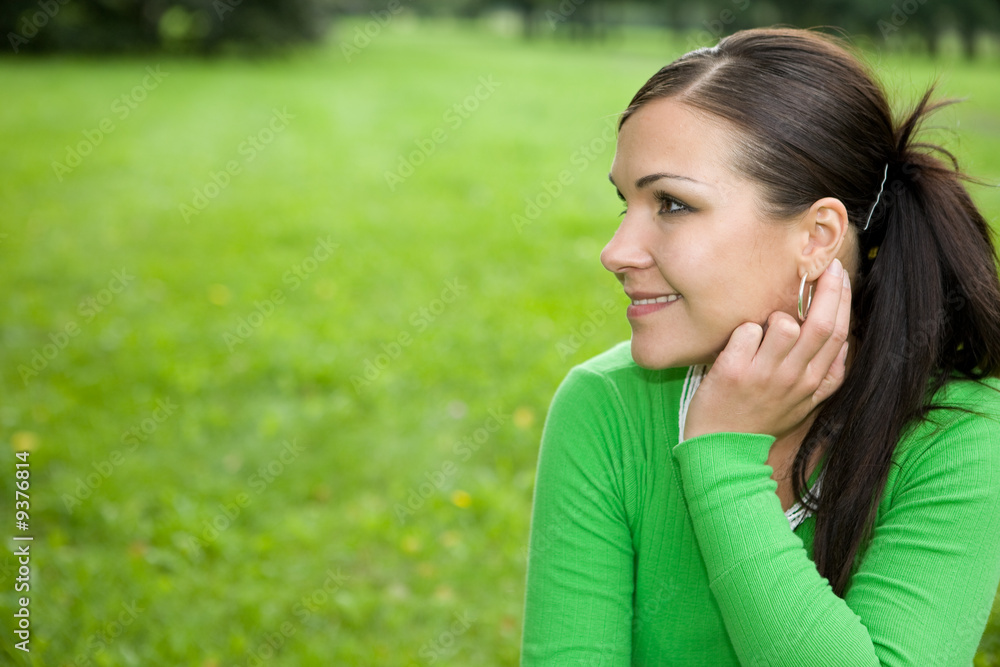 attractive brunette woman in park