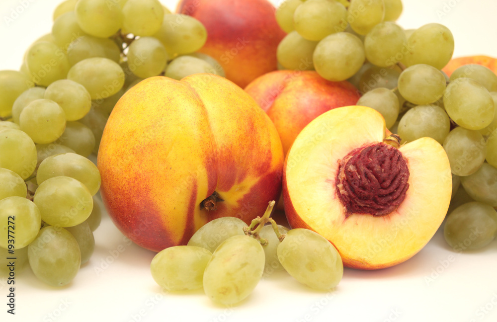 Bright, ripe fruit - grapes and nectarines. Object over white Bright, ripe fruit - grapes and nectarines. Object over white