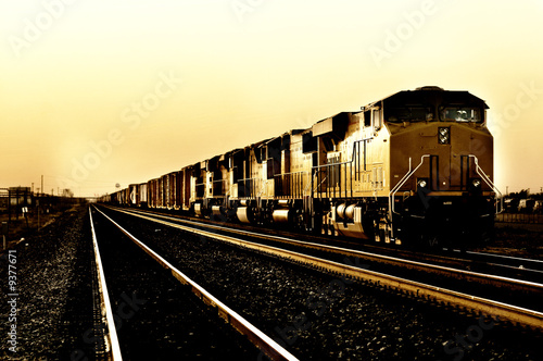 Freight train travelling through Arizona at Sunset photo