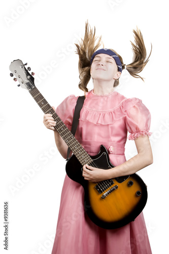Young girl with an electric rock guitar