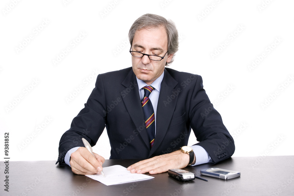 Mature businessman working, isolated over white background