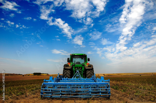 Fotografie The Tractor - modern farm equipment in field