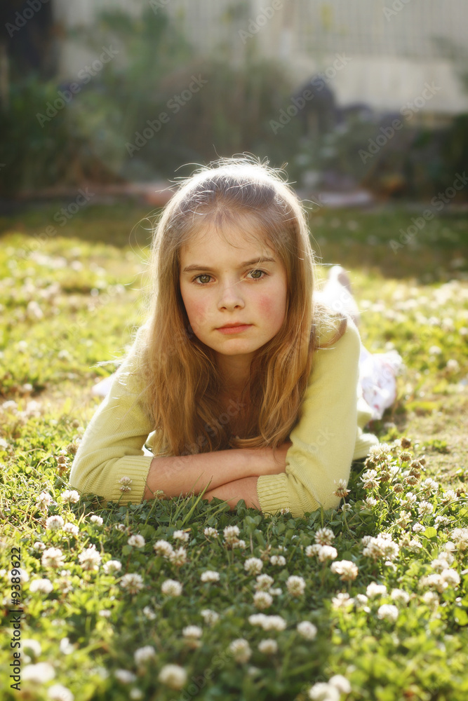 Beautiful girl lying on grass Beautiful girl lying on grass