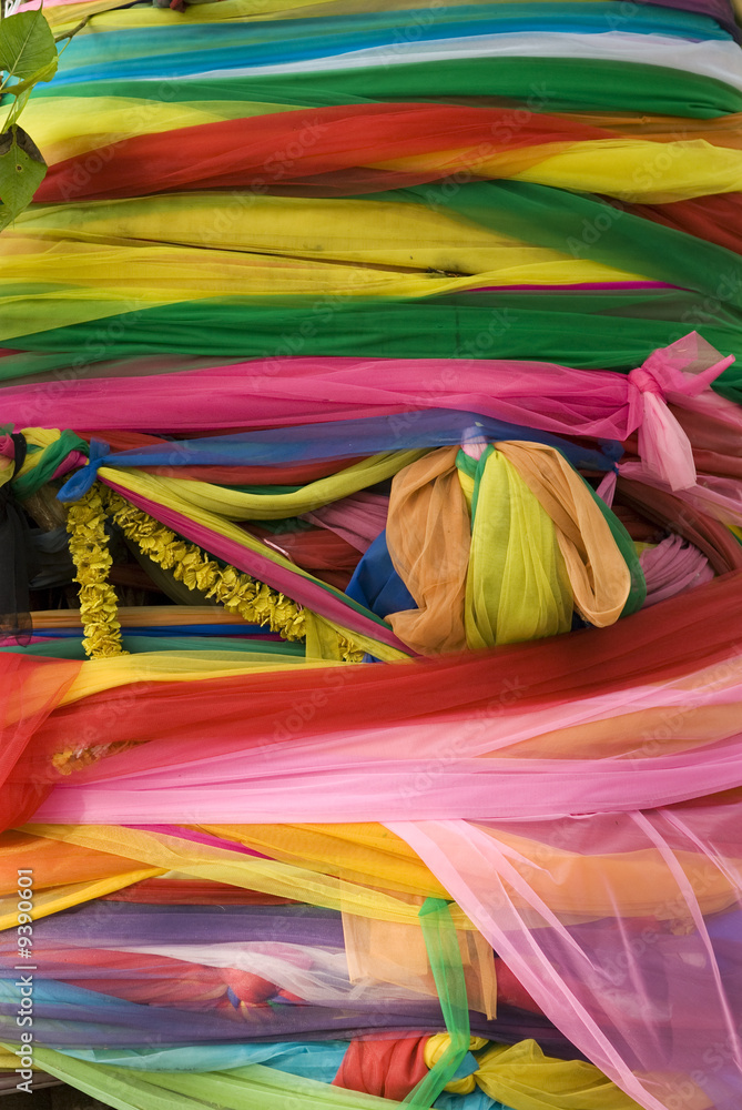 Colourful Buddhist, religious decorations of a holy tree