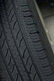 Closeup of a black car tire's tread
