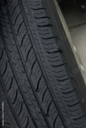 Closeup of a black car tire's tread © EugeneF