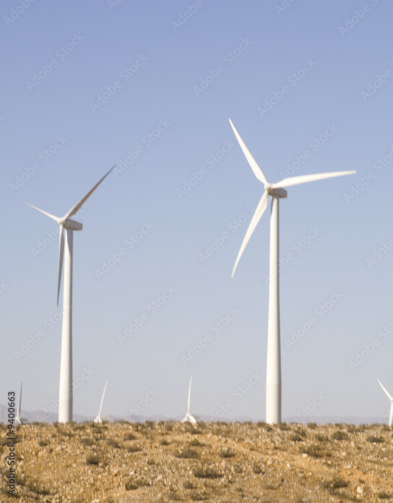 Fototapeta premium Blue Sky Smoke Free behind Electric Wind Mill Turbine