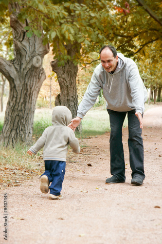 father and son in autumn park