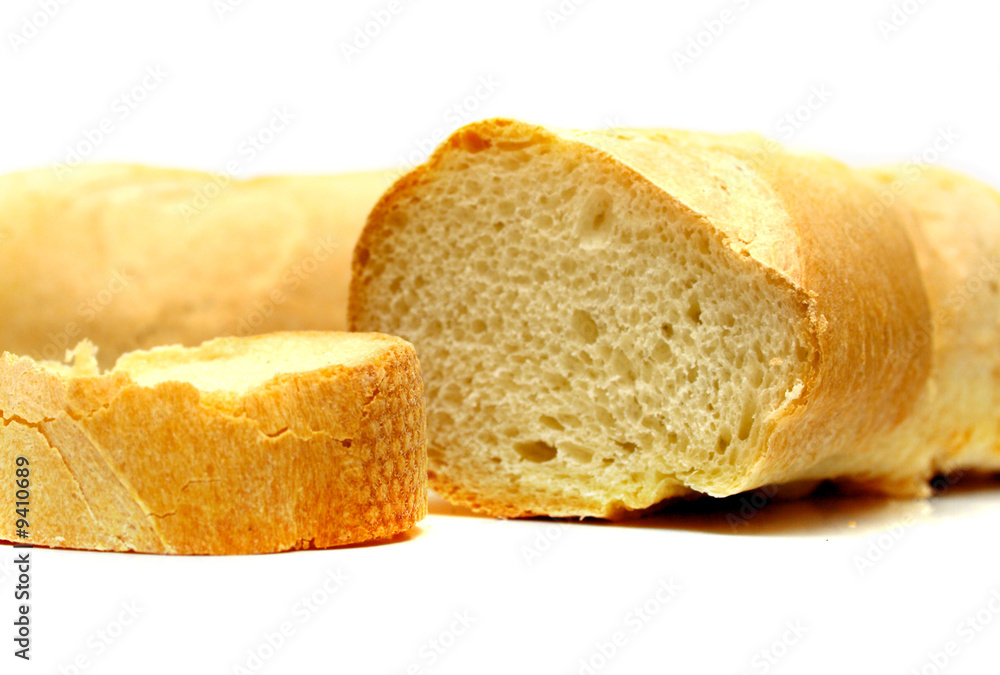 Fresh tasty bread which is cut on a part. Isolation on white.