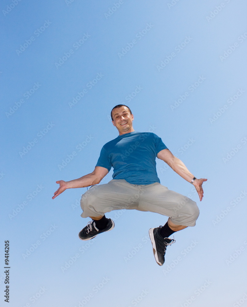 Young man jumping in the air Young man jumping in the air