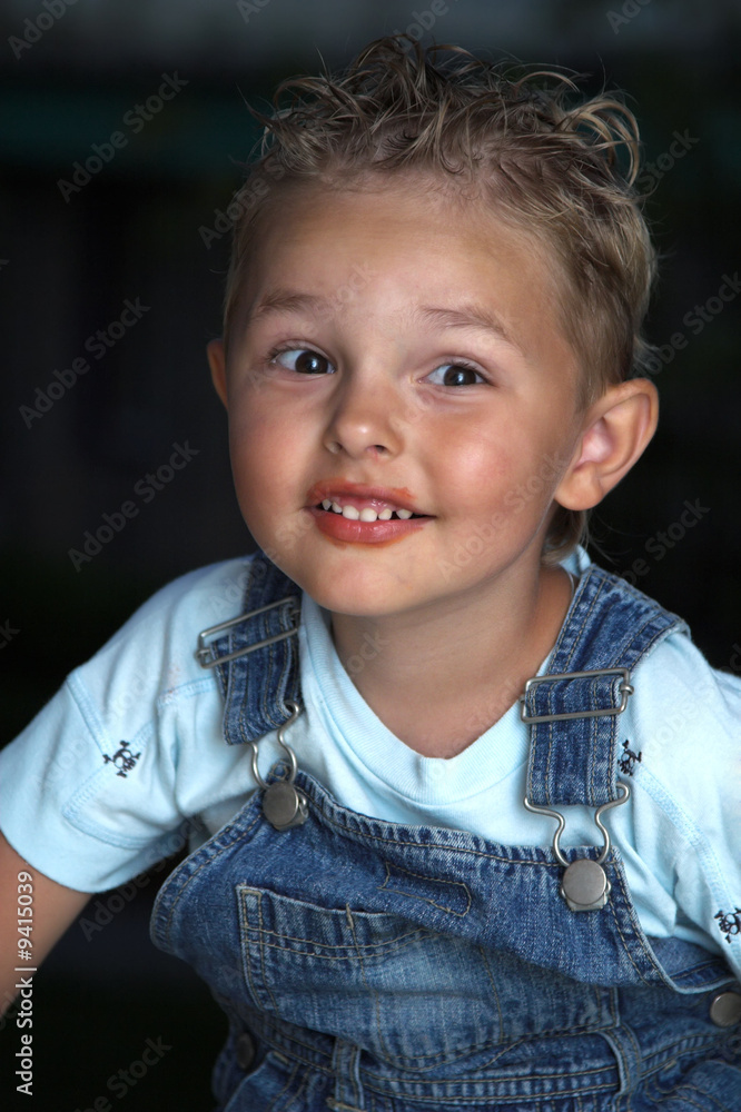 Smiling child is looking into the camera Smiling child is looking into the camera