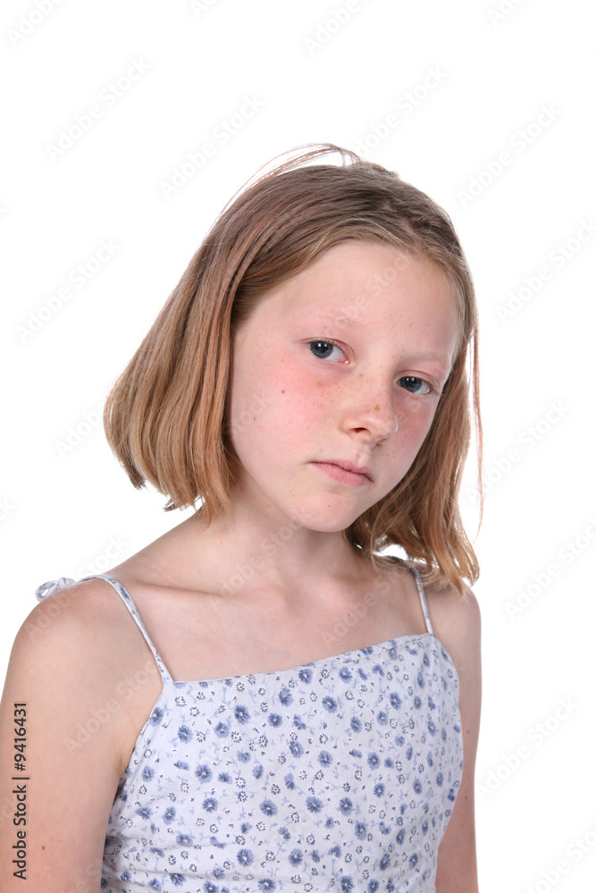 freckled girl looking sad; high key studio portrait freckled girl looking sad; high key studio portrait
