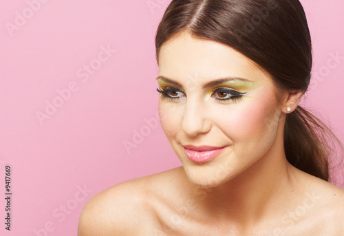 Smiling Young Woman On Pink Background