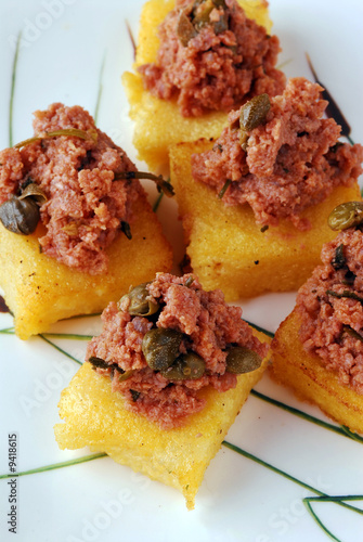 Quadratini di polenta al fagiano - Antipasti Toscana photo