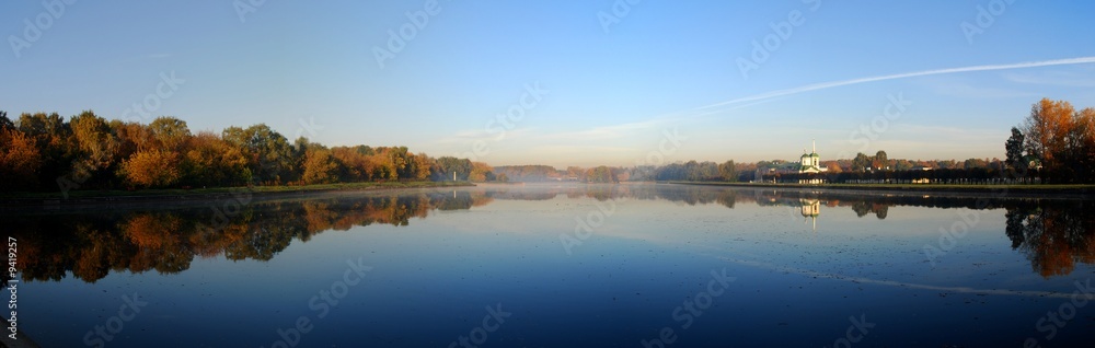 Panoramic autumn view of lake and forest
