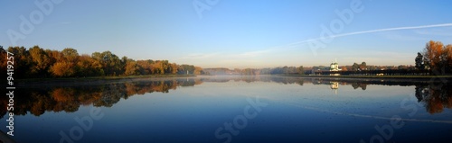 Panoramic autumn view of lake and forest