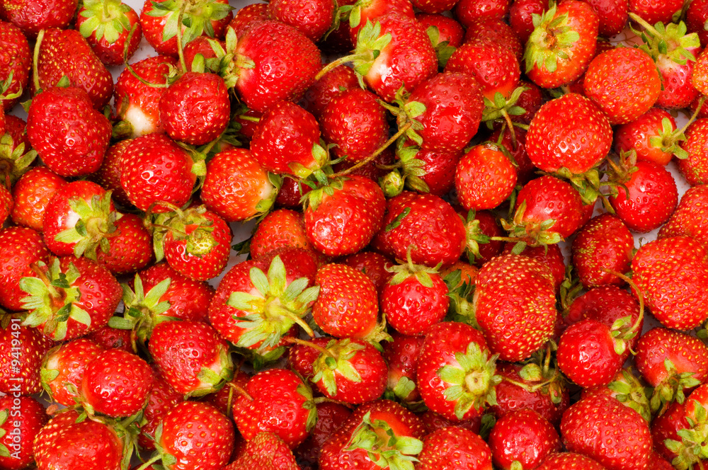 Fruit concept - red strawberries arranged as background Fruit concept - red strawberries arranged as background