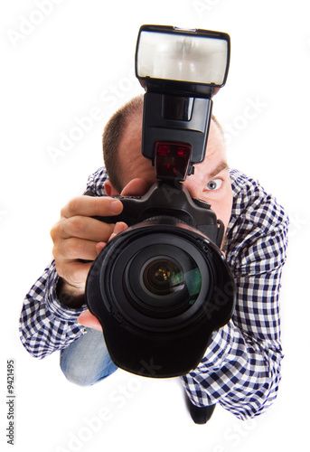 Professional photographer making the shoot. Isolated on white