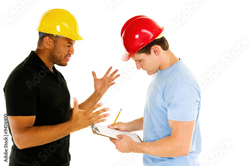 two construction men discuss project