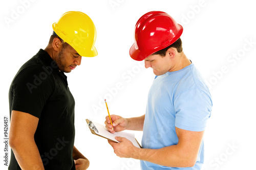 two construction men discuss project