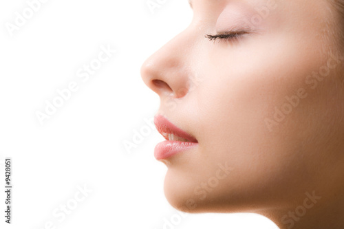 Obraz na plátně Profile of feminine face with closed eyes and make-up