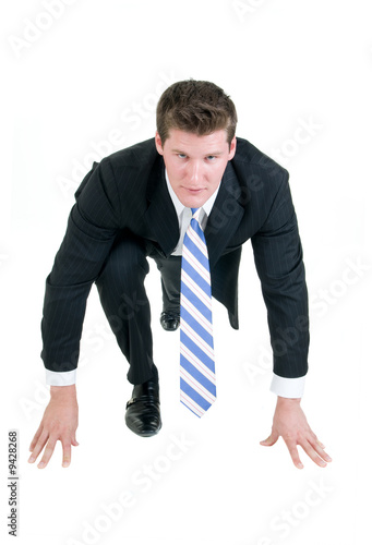 young businessman gets ready to sprint into the day