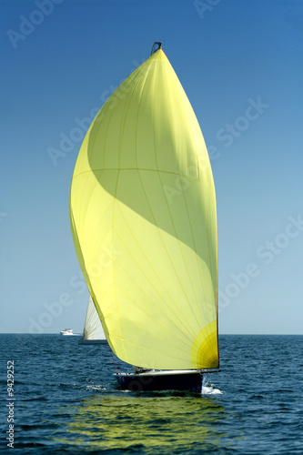 Sailing yacht with spinnaker in the wind / beautiful image