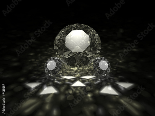 A three sparkling brilliant cut diamonds on dark background