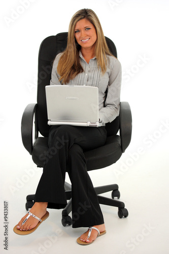 Happy young woman working o...