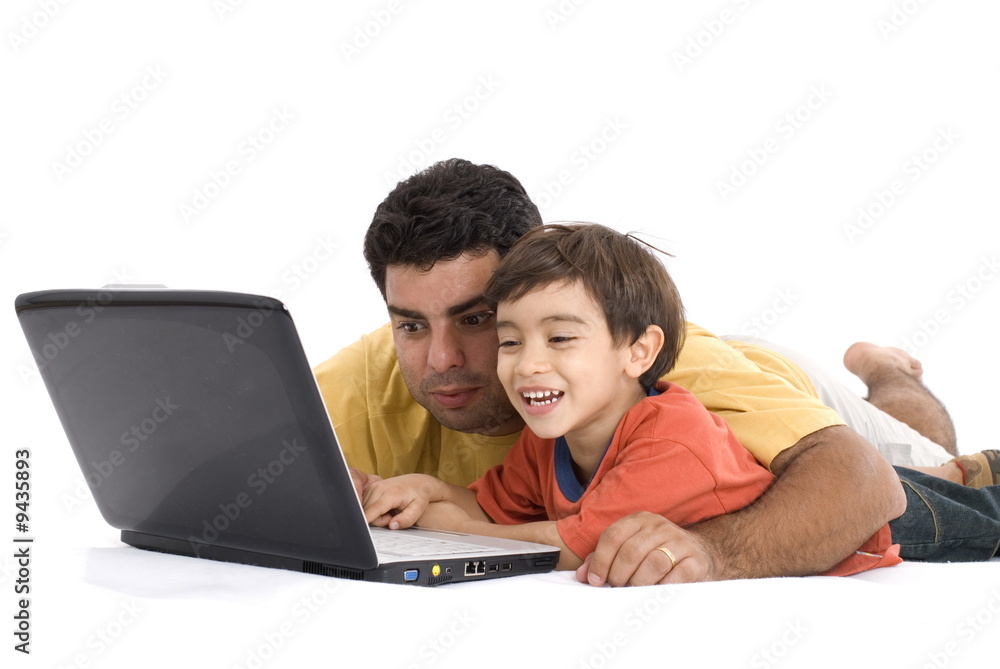 Parents having fun using the Laptop . Parents having fun using the Laptop .