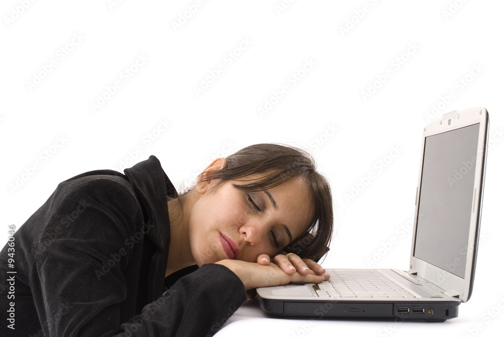 businesswoman resting with the head in the laptop .