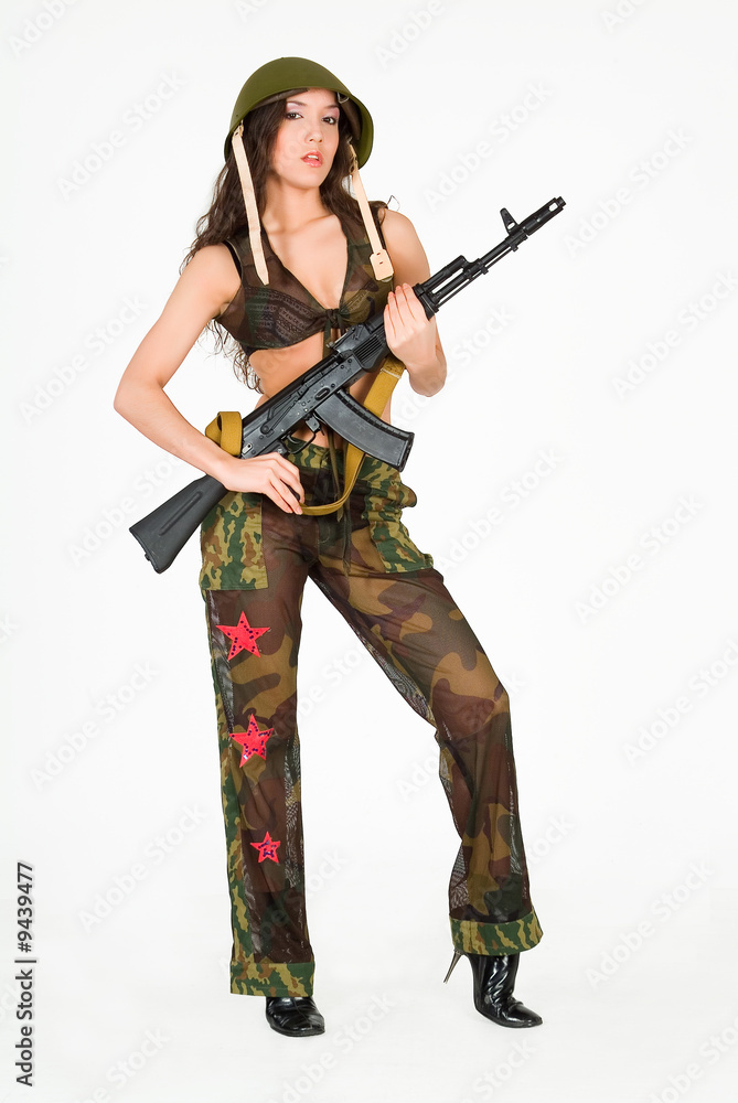 Young attractive woman in military clothes with machine gun Young attractive woman in military clothes with machine gun