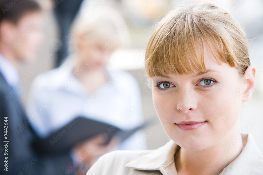 Close-up of charming lady in working environment Close-up of charming lady in working environment