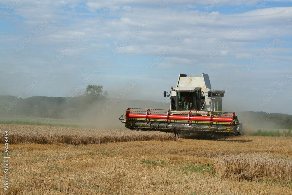 harvester on a wheat field harvester on a wheat field