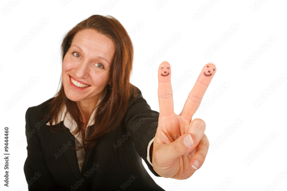 happy businesswoman showing smiling faces drawn on her fingers happy businesswoman showing smiling faces drawn on her fingers