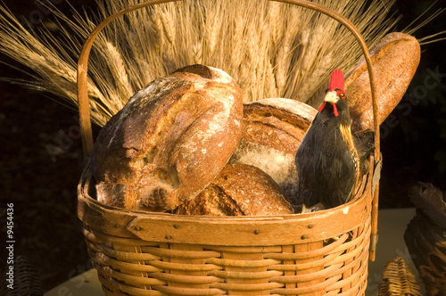 Bread in a basket with a chicken photo